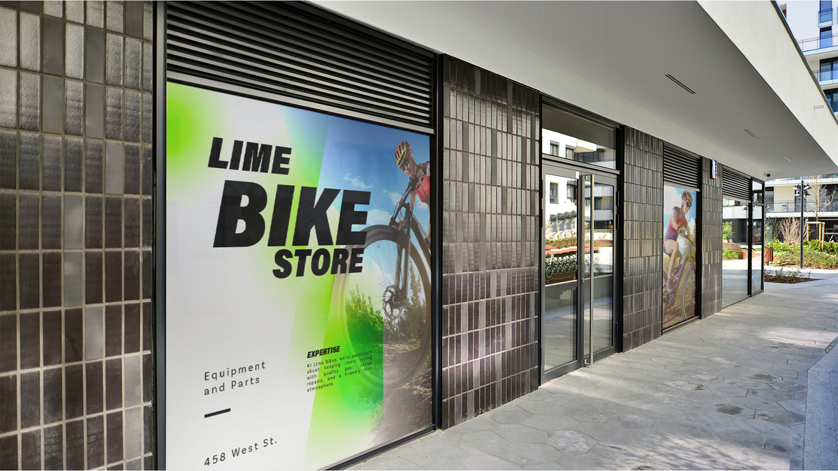 Large adhesive vinyl window graphic covering a shopfront pane at street level
