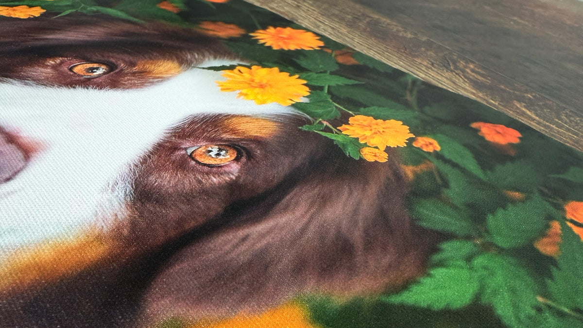 Close-up of a canvas print at a raking angle, showing the woven texture of the poly-cotton surface