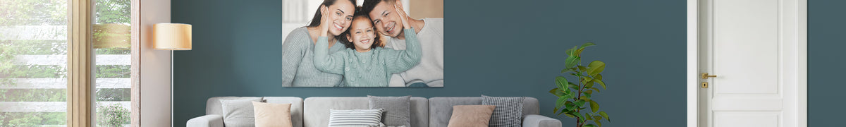 Wide stretched canvas print hung above a sofa in a living room