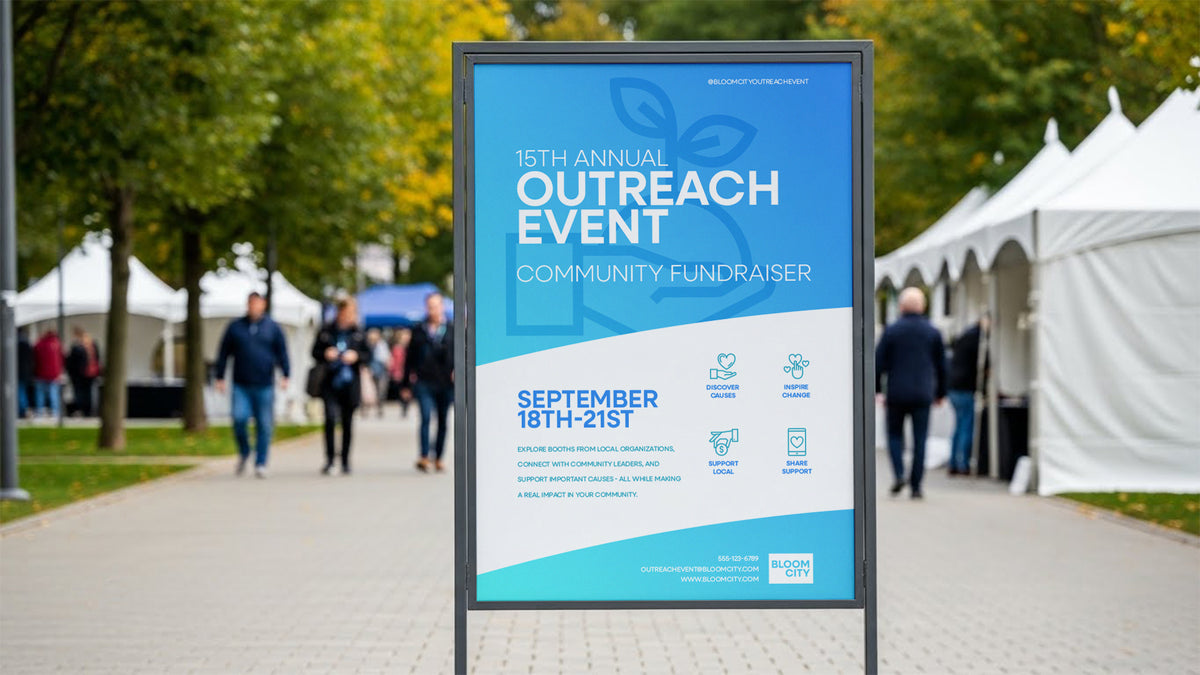 PVC event sign panel in a freestanding outdoor frame on a walkway